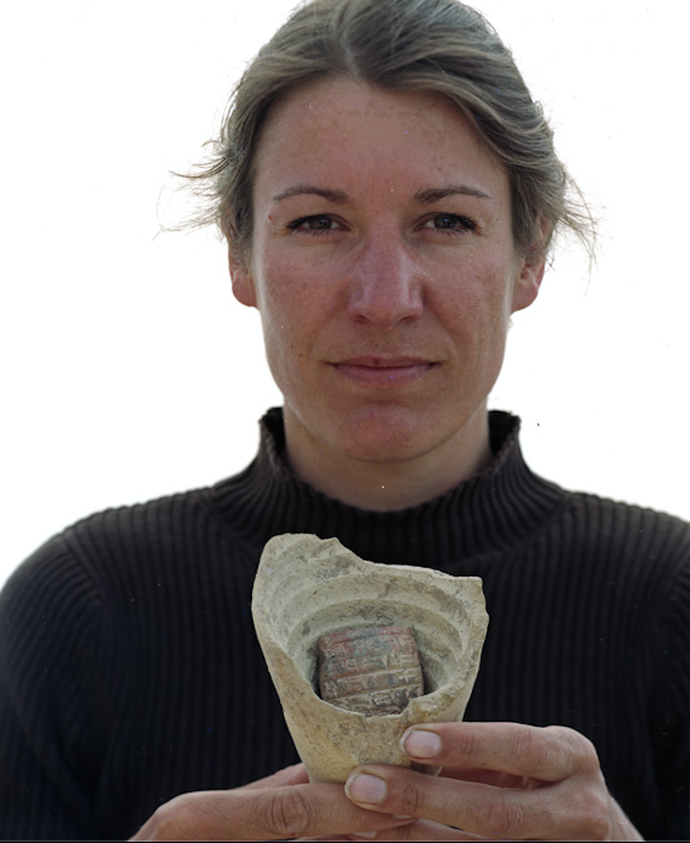 Stephanie Rost holding archeological artifact